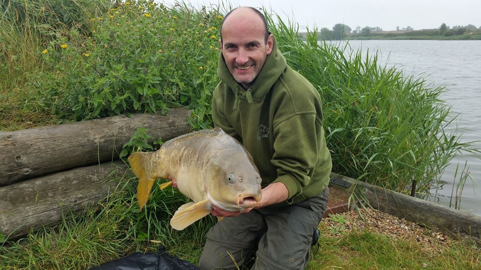 Bill Taylor with a nice looking 24lb carp. Photo