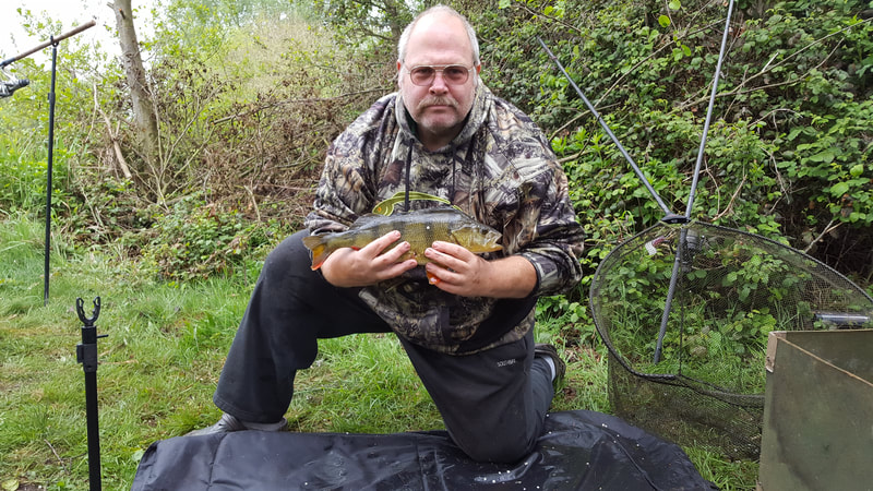 Andrew with a stunning perch. Photo