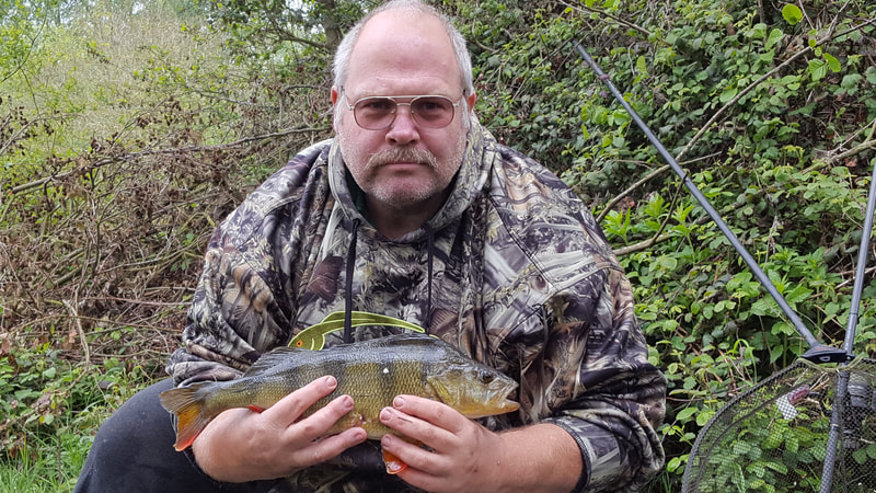 Andrew with a stunning perch. Photo