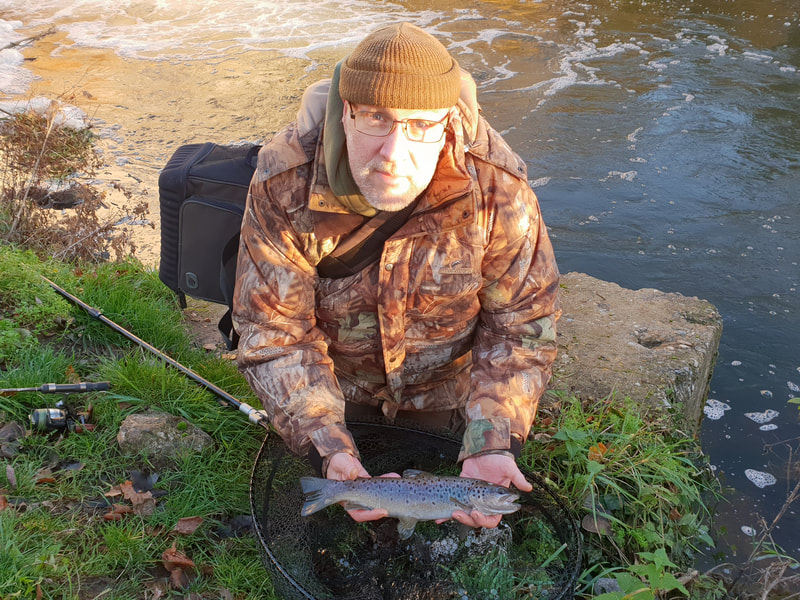 Steve Burgess with an unexpected trout. Photo